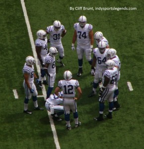 Andrew Luck gathers the Colts in his first-ever preseason huddle. He threw a 63-yard touchdown pass to Donald Brown on the play.