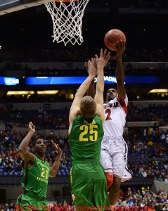 Loiusville's Russ Smith scores over Oregon's E.J. Singler. Photo by Ben Fahrbach.