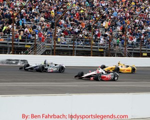 Tony Kanaan passes A.J. Allmendinger on Sunday.