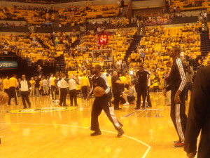 Miami's Dwyane Wade, center, and Chris Bosh, right, warm up while surrounded by Gold Swagger. Photo by Cliff Brunt.