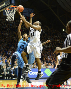 Roosevelt Jones (21) scores against Rhode Island.