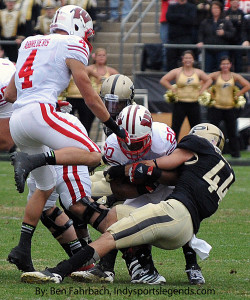 Wisconsin's James White tries to escape Purdue's Landon Feichter.