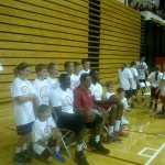 Victor Oladipo, Tom Crean and D.J. White pose with kids at Crean's youth camp Saturday at Assembly Hall. (Photo by Chris Goff.)