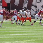 Bowling Green's Paul Senn (30) bursts unblocked through the line. He snagged the ball in front of punter Erich Toth and returned it 56 yards for a TD in the first quarter. (Photo by O'Connor.)