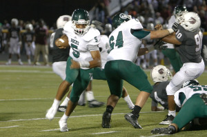 Louisville Trinity's Reggie Bonnafon (5) is one of the best dual-threat quarterbacks in the area. Photo by Justin Whitaker.