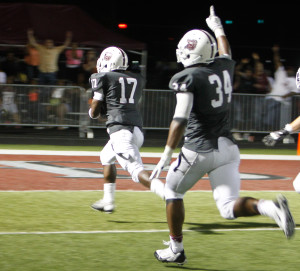 Lawrence Central's Marcus Fletcher (17) scores on an interception return against Louisville Trinity. Photo by Justin Whitaker.
