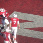 Tre Roberson (5), shown warming up before the game, started over Nate Sudfeld (7) and threw 5 TDs. (Photo by Chris Goff.)