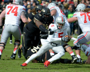 Purdue's Bruce Gaston (90) gets ahold of Ohio State quarterback Braxton Miller.