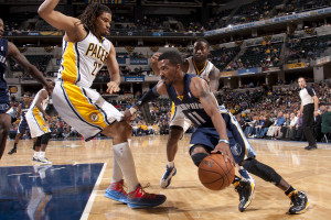 Memphis guard Mike Conley drives against Pacers forward Luis Scola. Photo by Jessica Hoffman, Pacers Sports and Entertainment.