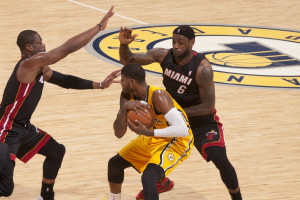 Dwyane Wade, left, and LeBron James, right, swarm Pacers forward Paul George. Photo by Frank McGrath, Pacers Sports and Entertainment.