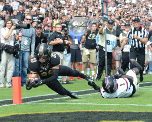 Purdue's Danny Anthrop reaches for the pylon. Photo by Ben Fahrbach.