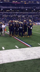 Notre Dame huddles on the field at Lucas Oil Stadium. Photo by Brock Sanders.