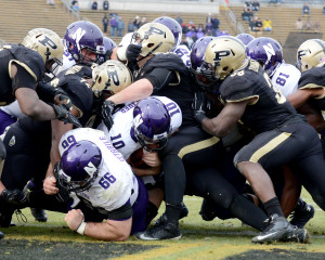 Northwestern quarterback Zack Oliver sneaks it in for a touchdown in the fourth quarter against Purdue. Photo by Ben Fahrbach.