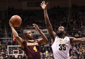 Purdue's Rapheal Davis (35)  defends against Minnesota's DeAndre Mathieu. Photo by Purdue Athletics.