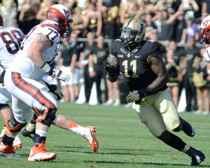 Purdue's Antoine Miles rushes against Virginia Tech's Wade Hansen. Photo by Ben Fahrbach.