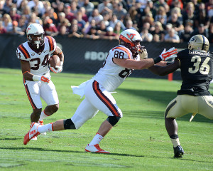 Virginia Tech's Travon McMillian (34) runs behind Ryan Malleck. Photo by Ben Fahrbach.