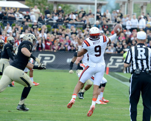 Pressure on Virginia Tech quarterback Brenden Motley. Photo by Ben Fahrbach.