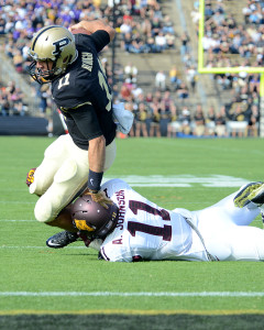 Purdue quarterback David Blough tackled by Minnesota's Antonio Johnson. Photo by Ben Fahrbach.