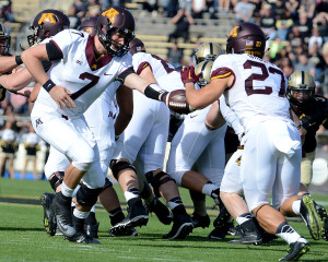 Minnesota's Mitch Leidner (7) hands off to Shannon Brooks (27). Photo by Ben Fahrbach.